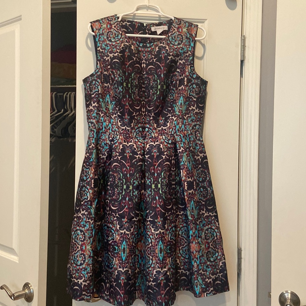 Liz Claiborne size 12 midi pleated skirt. Gently worn.Hidden zipper in back.